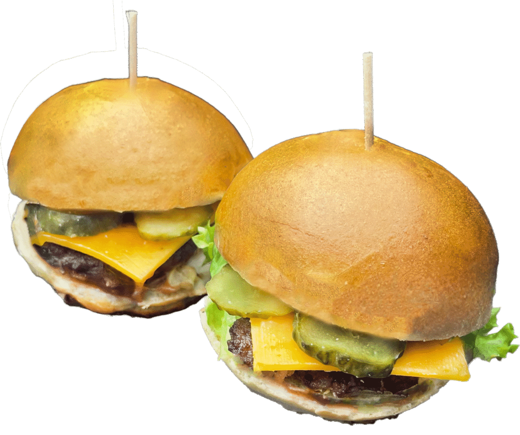 Jetzt Mini Burger in Wien genießen: Rindfleisch, Cheddar, Röstzwiebel, Essiggurkerl, Burgersauce oder Ketchup & Mustard – im Jour-Burgerbun.