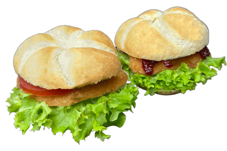 Schnitzelsemmel in Wien bestellen – saftiges Hühnerschnitzel mit Tomate, Salat und Cocktailsauce oder Wild-Preiselbeeren in Jour-Semmel.